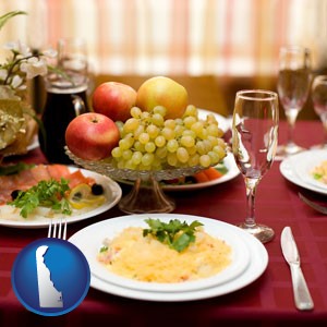 a gourmet restaurant table setting, with entree and appetizer - with Delaware icon