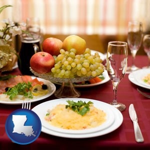 a gourmet restaurant table setting, with entree and appetizer - with Louisiana icon