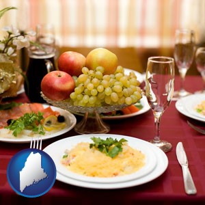 a gourmet restaurant table setting, with entree and appetizer - with Maine icon