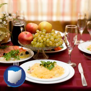 a gourmet restaurant table setting, with entree and appetizer - with Ohio icon