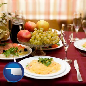 a gourmet restaurant table setting, with entree and appetizer - with Oklahoma icon
