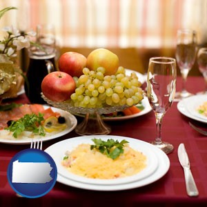 a gourmet restaurant table setting, with entree and appetizer - with Pennsylvania icon