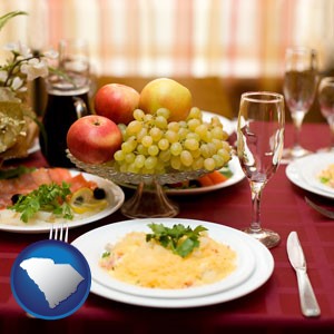 a gourmet restaurant table setting, with entree and appetizer - with South Carolina icon